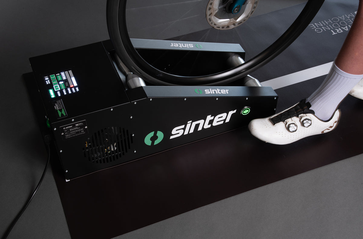 Sinter Smart Bedding Machine close-up showing digital display and bicycle wheel