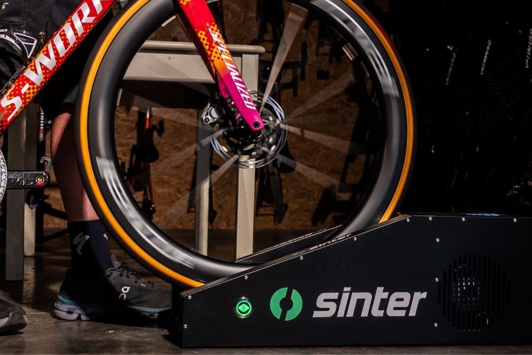 Specialized S-Works bike mounted on Sinter Smart Bedding Machine in workshop